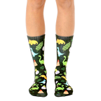 Crew socks in dark green with colorful dinosaurs, volcano, and foliage illustrations. [lf]