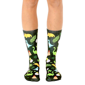 funky black crew socks with dinosaur, egg, and plant motifs.  