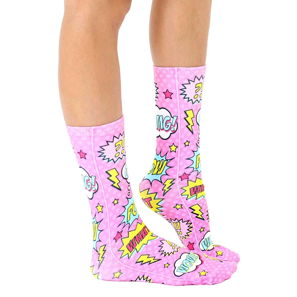 Lifestyle shot showing the Pink Comic socks on a person's legs, showcasing the socks' fit and design. [lf]