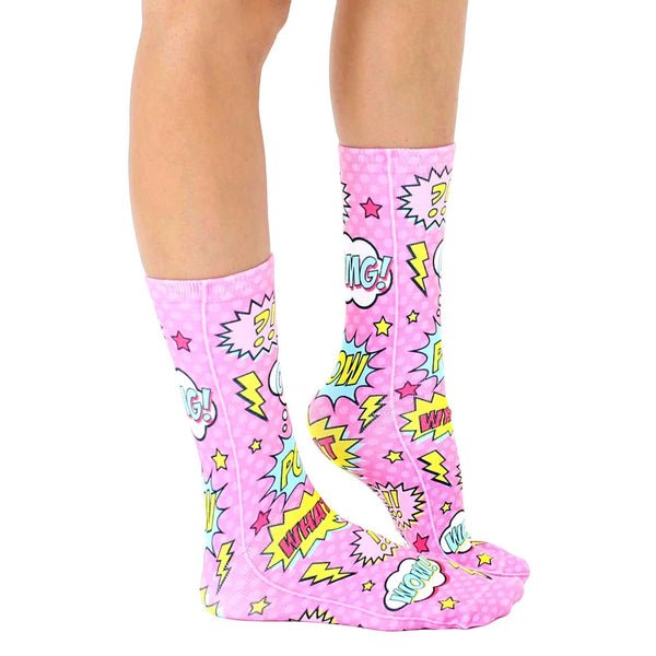 Lifestyle shot showing the Pink Comic socks on a person's legs, showcasing the socks' fit and design. [lf]