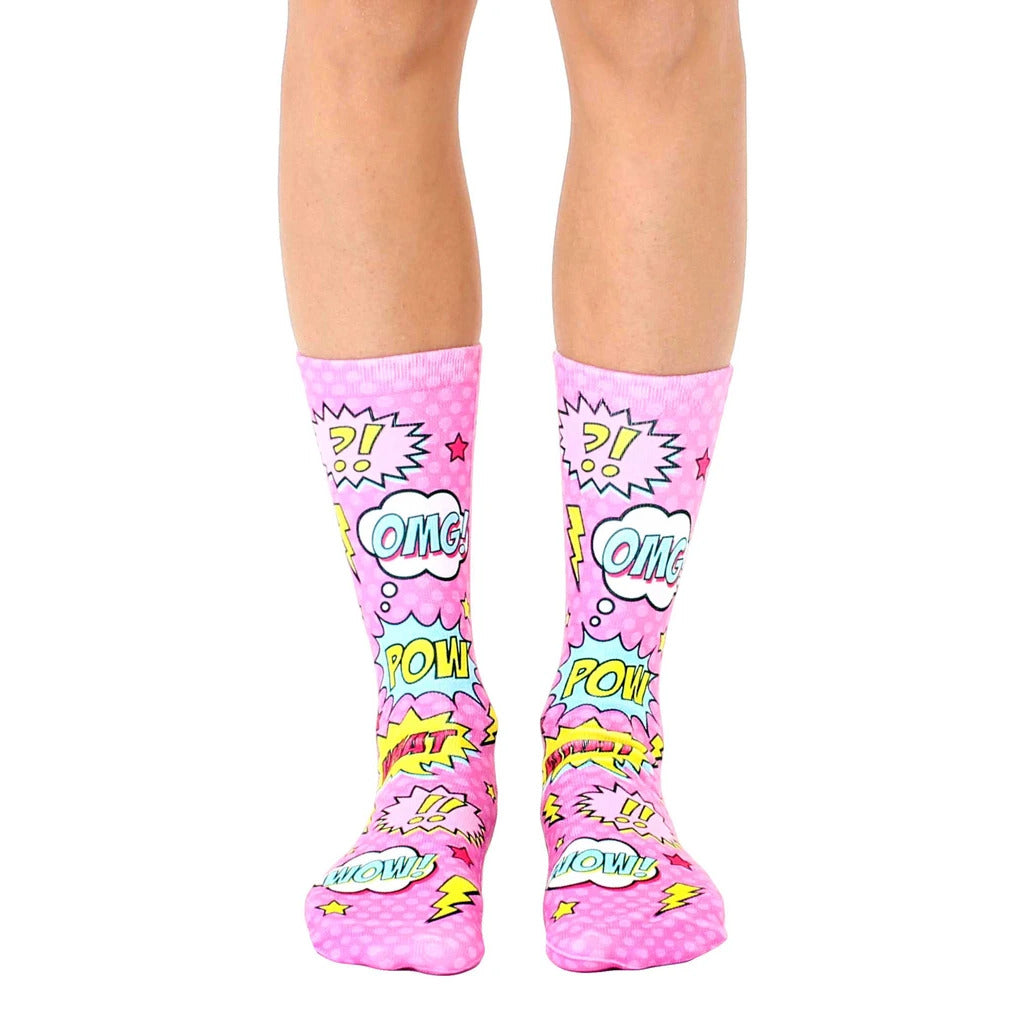 Crew socks in pink with a comic book design featuring speech bubbles and sound effects like 'POW!' and 'OMG!' [lf]