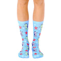 A pair of light blue crew socks featuring a pattern of cute seahorses and red starfish. [lf]