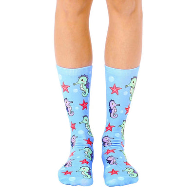 cartoon seahorse and starfish pattern socks made for women with a crew length.  