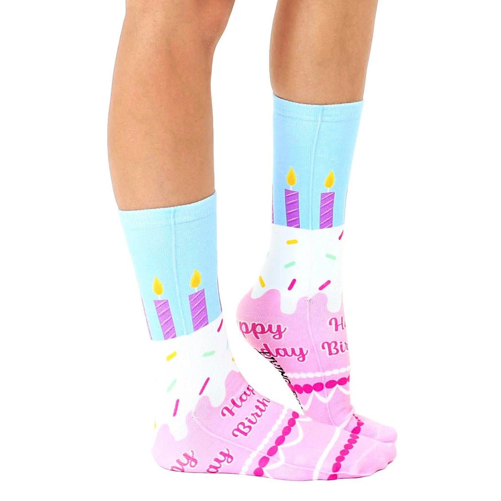 Lifestyle photo showcasing the Birthday Cake socks on a person's feet. [lf]
