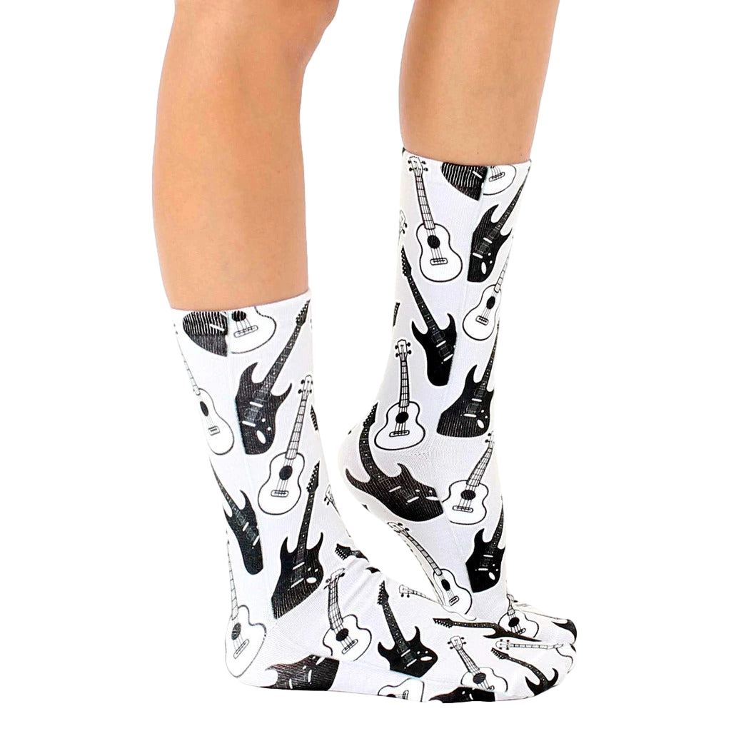 Lifestyle photo showcasing the Guitar Socks on a person's feet, showing the socks from the side. [lf]