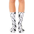 A pair of white crew socks with a repeating pattern of black and white electric and acoustic guitars. [lf]
