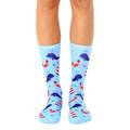 A pair of light blue crew socks with a whimsical design featuring whales, lighthouses, and crabs. [lf]