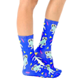 Lifestyle shot showing the Partysaurus socks on a person's feet, from the side [lf]