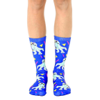 A pair of blue crew socks with a fun 90s-themed design.  The socks feature cartoon dinosaurs wearing sunglasses and boomboxes, along with yellow triangles and pink zigzags. [lf]