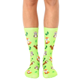 Lime green crew socks featuring adorable foxes, owls, and squirrels, alongside small green leaves. [lf]