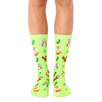 Lime green crew socks featuring adorable foxes, owls, and squirrels, alongside small green leaves. [lf]