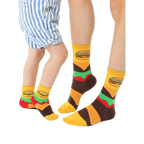 Adult and child crew socks in yellow, brown, and green.  Burger graphics and stripes decorate these fun, matching food socks. [lf]