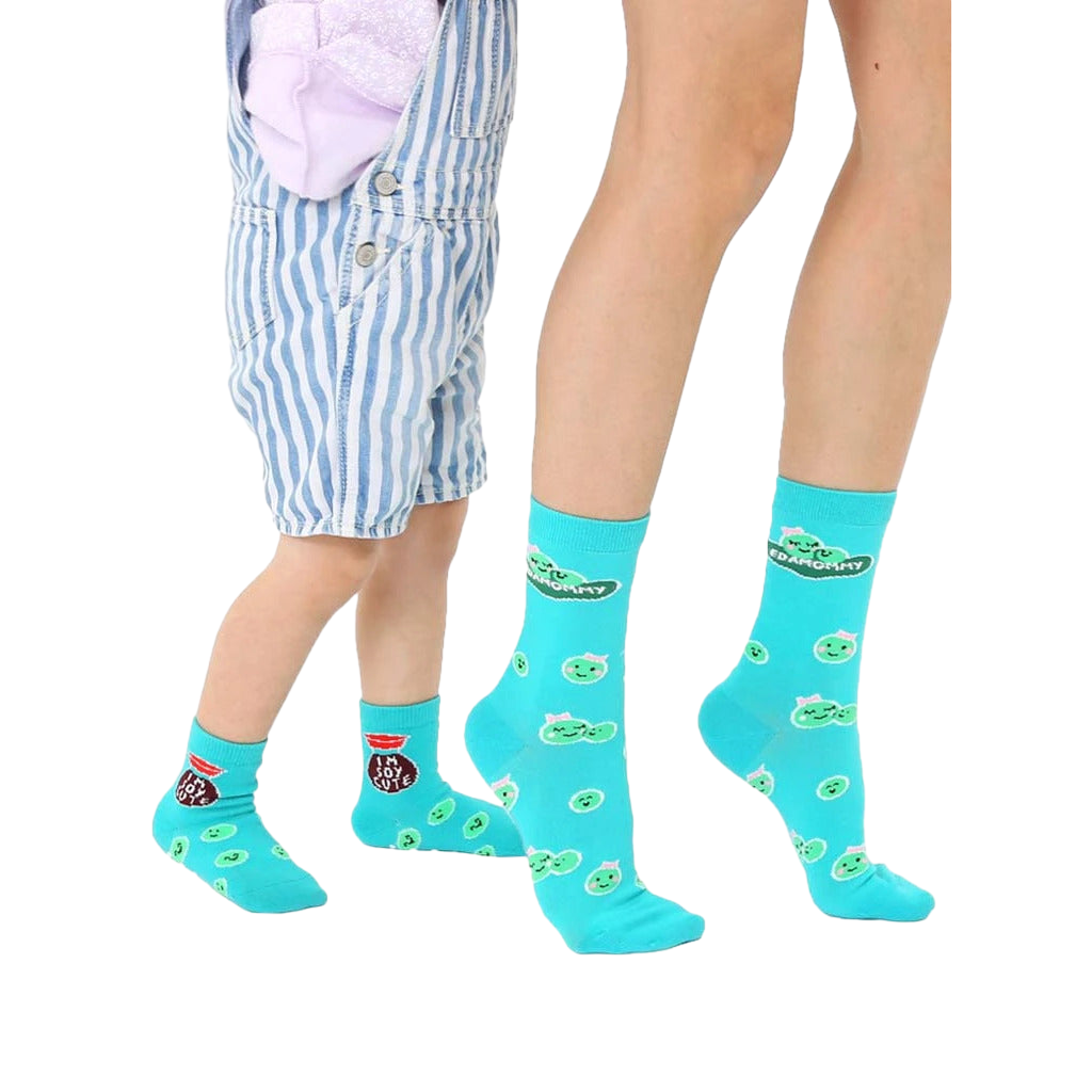 Adult and child teal crew socks.  Features cute peapod faces and 'Edamommy' text. Grippers on baby socks. [lf]