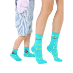 Adult and child teal crew socks.  Features cute peapod faces and 'Edamommy' text. Grippers on baby socks. [lf]