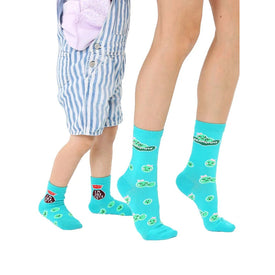 **cartoonish pea-patterned turquoise crew socks for kids, women, and men.**  