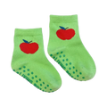 Close-up of a pair of lime green baby socks with a red apple and non-slip grips.