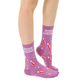 Close-up of adult 'Wine Game Strong' socks on a model's feet, showcasing the sock's design and color. [lf]