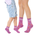 Adult and child crew socks in purple.  They feature a repeating pattern of wine bottles, wine glasses, and the text 'Wine Game Strong'. [lf]