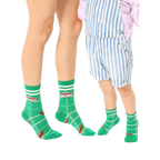 Adult and child-sized green crew socks. Football field design, brown footballs, white stripes, and 'Quarterback' text. [lf]