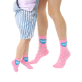 Adult and child pink crew socks with white polka dots and a blue heart that says 'Best Friends'. [lf]