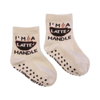 A pair of mini 'Coffee Me And Mini' socks; shows the grippers on the bottom.