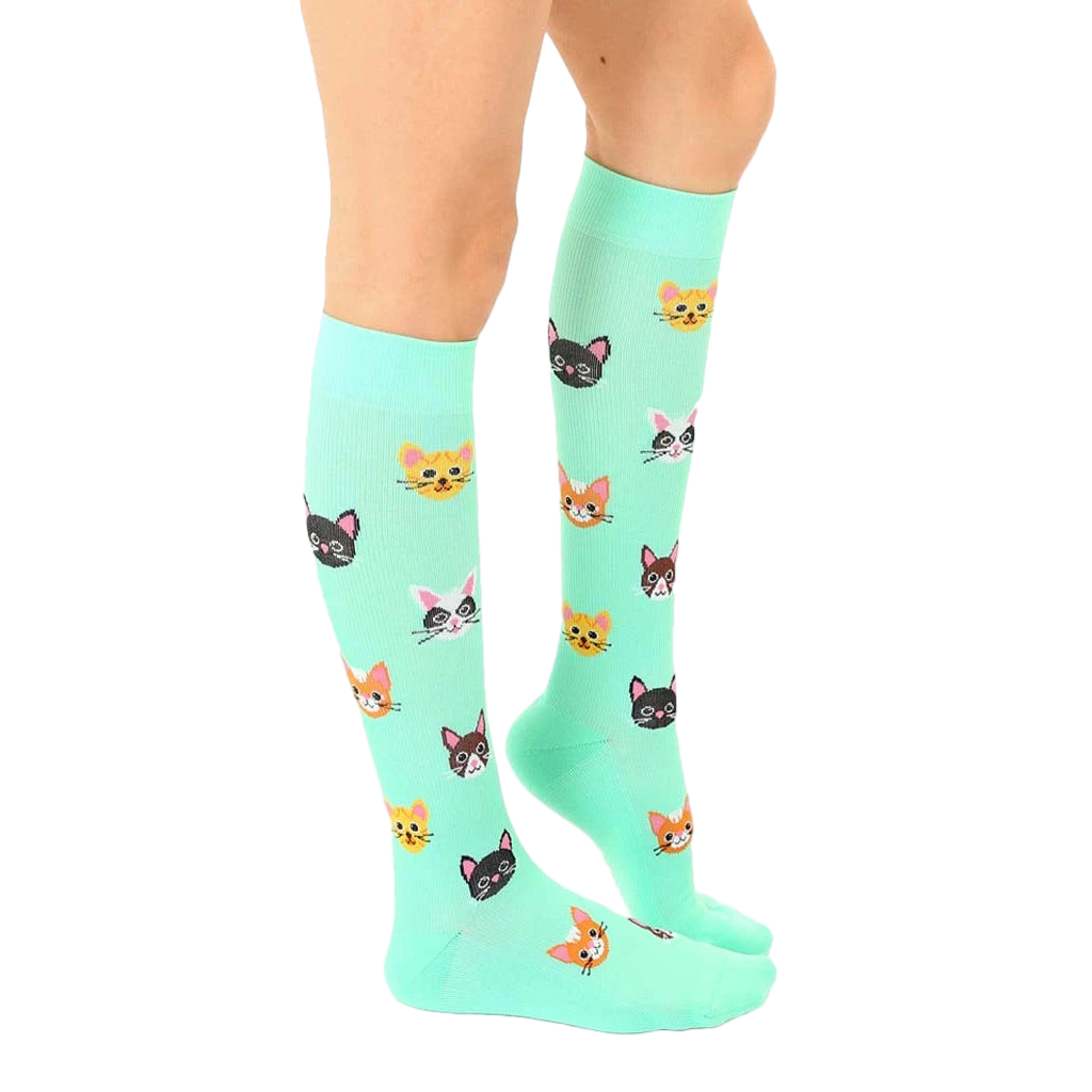 Lifestyle photo showing the cat socks on a person's legs. [lf]