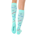 Rear view of mint green knee-high socks showcasing the 'Living Royal' branding on the heel. [lf]