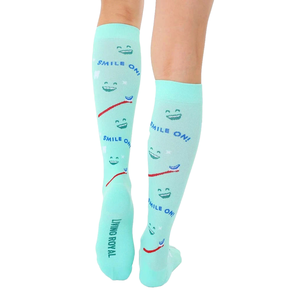 Rear view of mint green knee-high socks showcasing the 'Living Royal' branding on the heel. [lf]