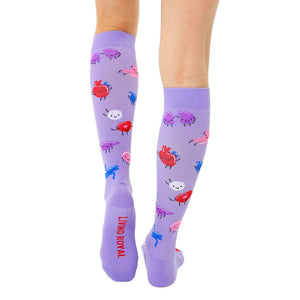 A pair of purple knee-high socks with cartoon organs on them. The organs include a heart, a brain, a liver, a kidney, a pancreas, and a stomach.