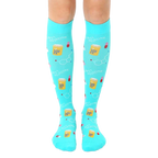 Pair of turquoise knee-high socks with a pattern of pills, beakers, and the text "Best Medicine." [lf]