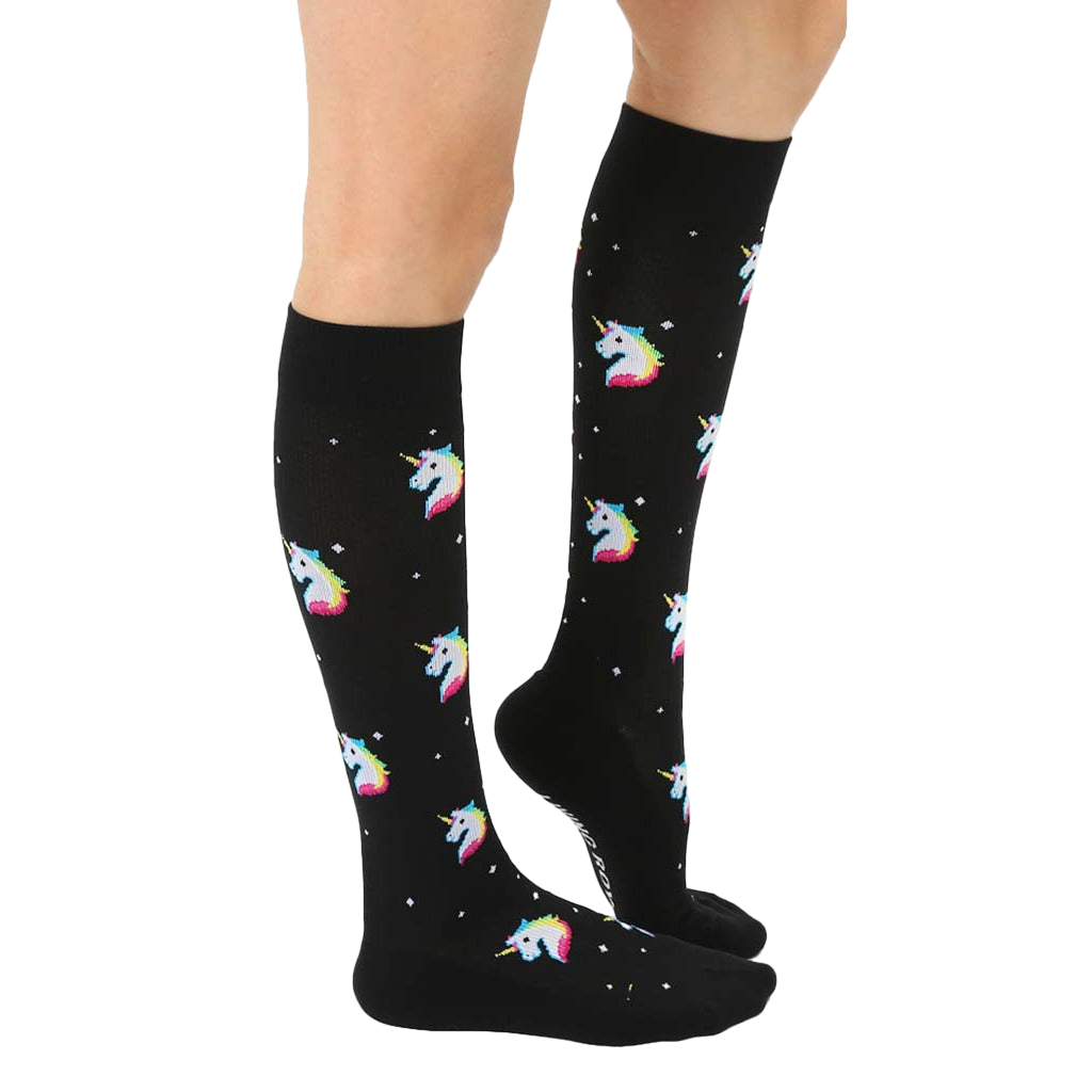 Lifestyle shot of a person wearing the black knee-high unicorn socks, showing the fit and style. [lf]