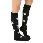 Lifestyle shot of a person wearing the black knee-high unicorn socks, showing the fit and style. [lf]
