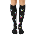 Pair of black knee-high socks with a pattern of rainbow pixel unicorn heads and small white stars. [lf]