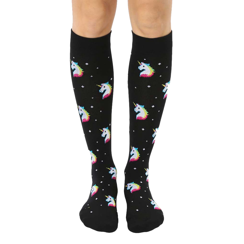 Pair of black knee-high socks with a pattern of rainbow pixel unicorn heads and small white stars. [lf]