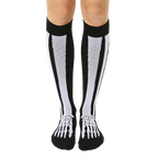 Pair of black knee-high socks with a white skeleton design. The bones run vertically up the leg and across the feet. [lf]