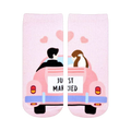 Pink ankle socks showing a cartoon bride and groom in a pink car with 'Just Married' sign.  Sweet wedding-themed design.