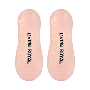 Close-up showing the back of the socks with 'Living Royal' vertically printed on each sock.