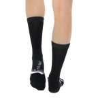 Back view of a pair of Ruth Bader Ginsburg socks worn, displaying the 'Living Royal' logo on the heel. [lf]