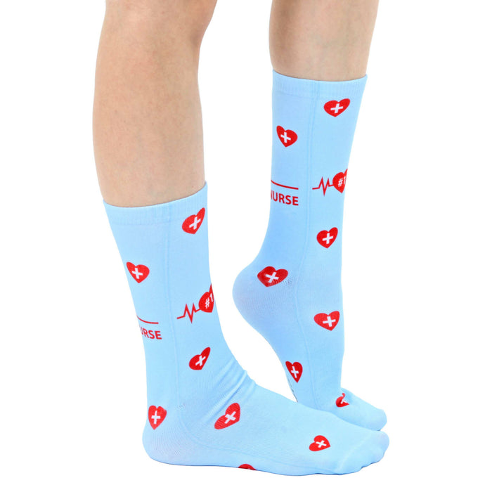 A pair of blue socks with a red heart and EKG design and the word 