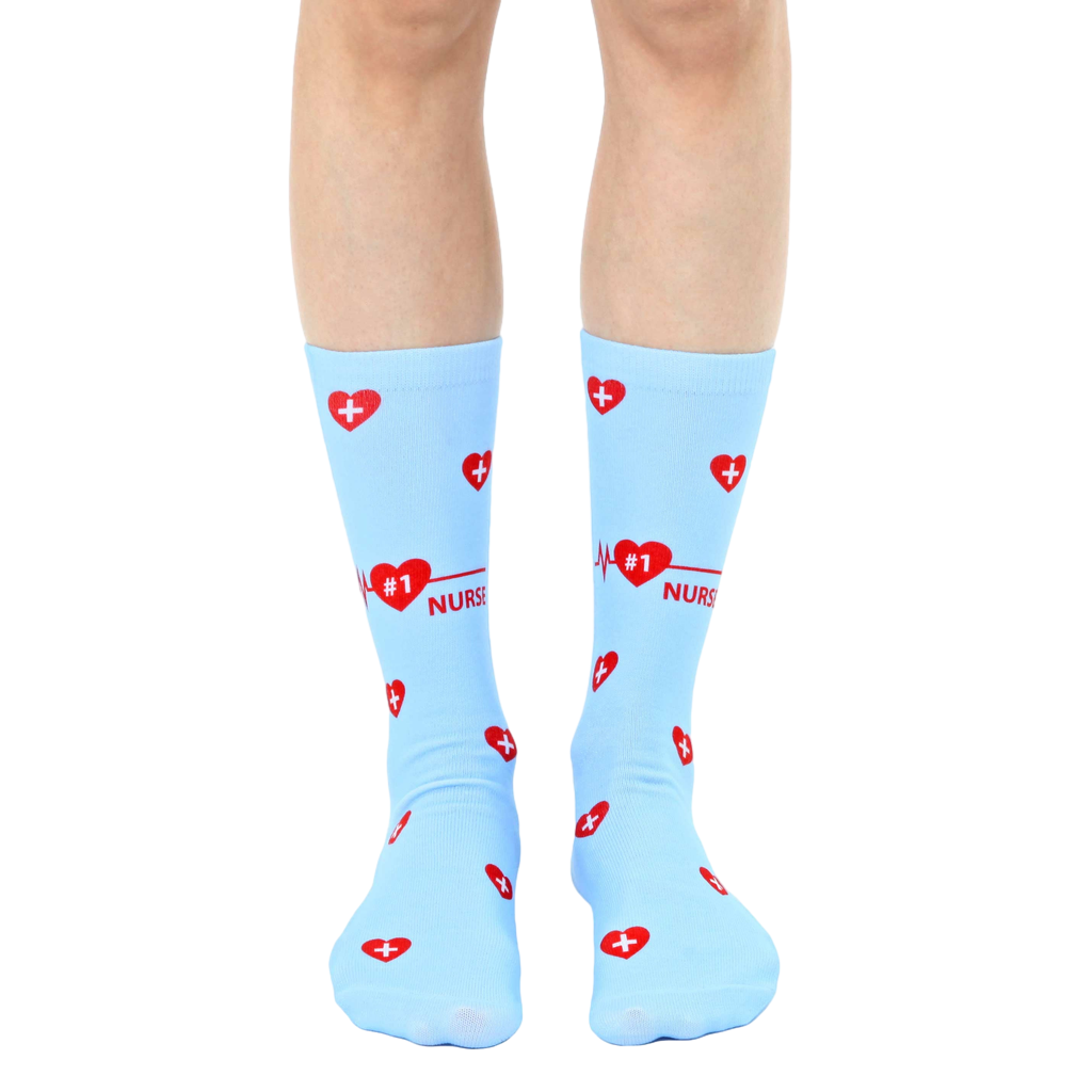 Pair of light blue crew socks with a red heart, EKG line, and '#1 Nurse' design. Perfect for nurses! [lf]