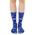 Pair of navy blue crew socks with a fun design featuring red medical icons (pills, bandages, stethoscope) and the word HERO. [lf]