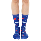 Pair of navy blue crew socks with a fun design featuring red medical icons (pills, bandages, stethoscope) and the word HERO. [lf]