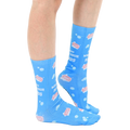 Lifestyle shot of model wearing the 'Wash Your Hands' socks, showcasing the fit and design on a person's legs. [lf]