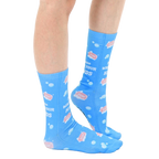 Lifestyle shot of model wearing the 'Wash Your Hands' socks, showcasing the fit and design on a person's legs. [lf]