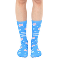 Pair of light blue crew socks featuring a playful design of pink soap bars and bubbles, with the text 'Please Wash Your Hands' repeated. [lf]
