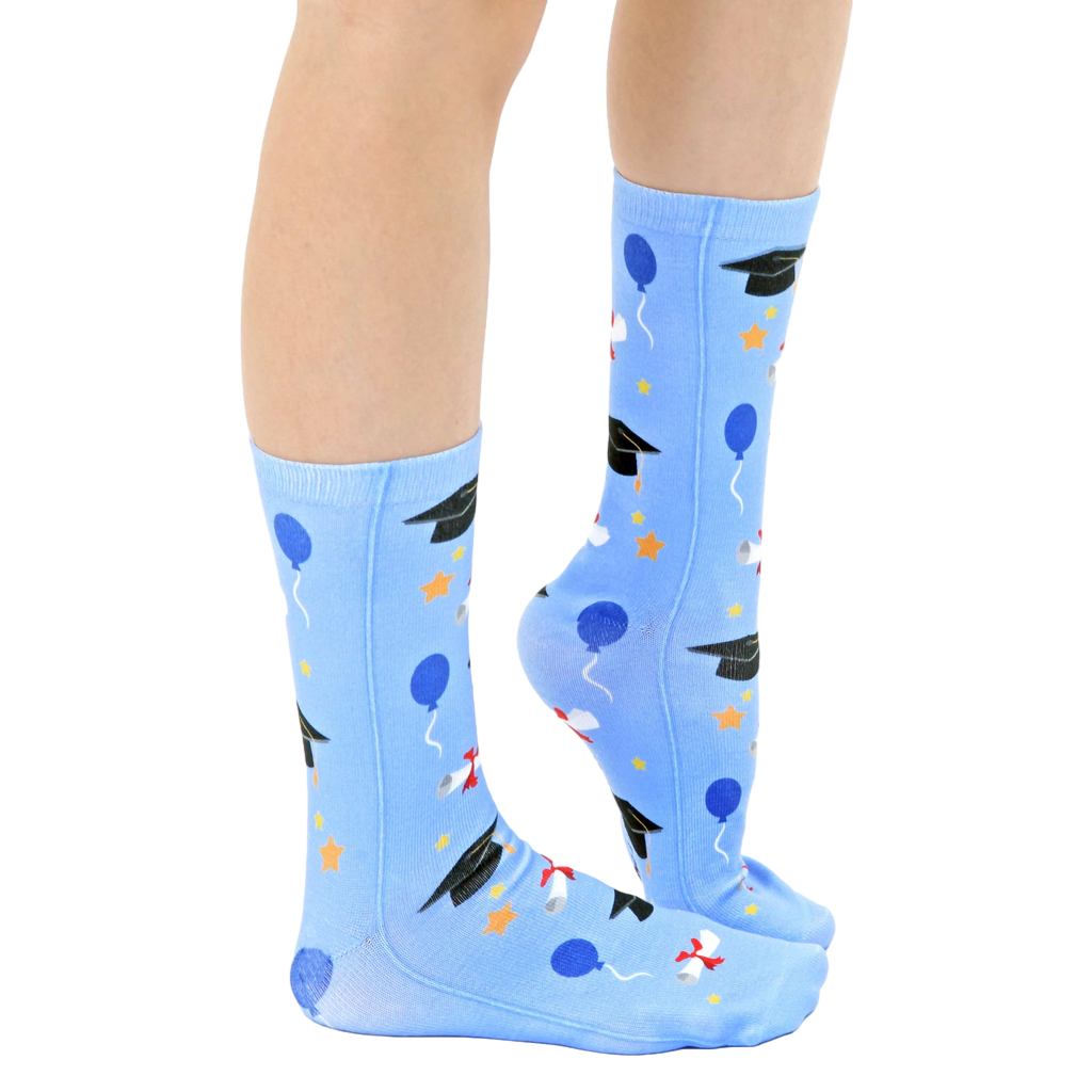 Lifestyle shot of a person's legs wearing the graduation socks, showing how they look when worn. [lf]