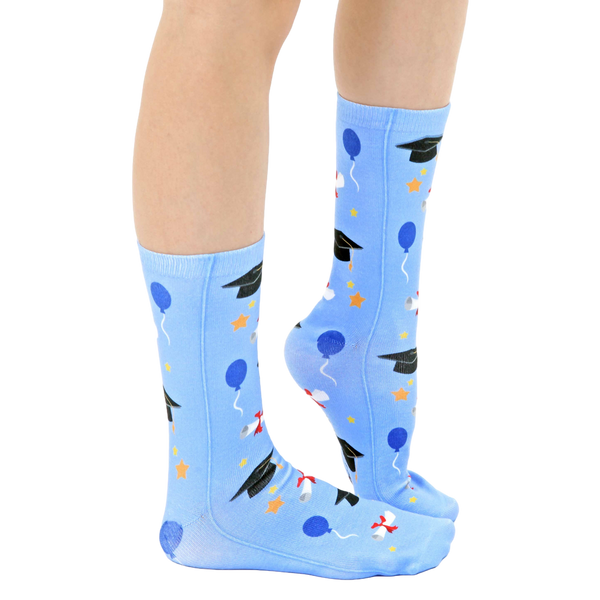 Lifestyle shot of a person's legs wearing the graduation socks, showing how they look when worn. [lf]
