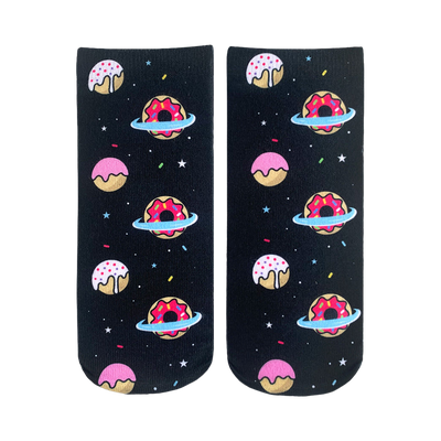 Crew socks with a black background, featuring pink, white, and red donuts orbiting in space. The donuts have sprinkles and icing.