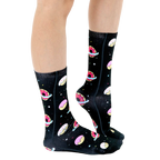 Lifestyle shot of a person's legs wearing the Galaxy Donut socks, showcasing the socks' fit and design. [lf]