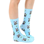 Lifestyle shot of model wearing light blue panda bamboo socks. [lf]